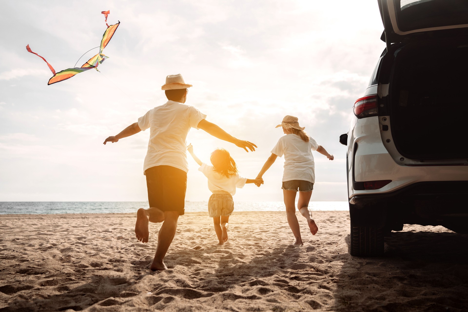 Happy Family with car travel road trip. summer vacation in car in the sunset, Dad, mom and daughter happy traveling enjoy together driving in holidays, people lifestyle ride by automobile.